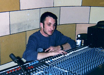 Doug McKendrick sitting at the soundboard.