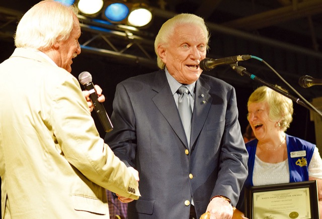 Tommy Hunter receiving an award from the barn dance historical society.